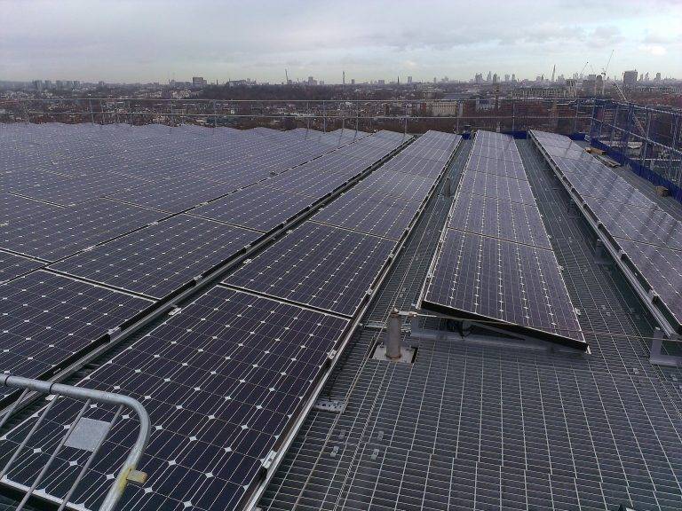 team members reviewing site solar performance data